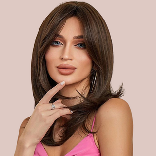 HOC242-6 Long Layered Shoulder Length Wig modelled for House of Chastity. A dark brown mid-length wig simply styled to shape the face and the centre parting with the long-length fringe naturally grades into the sides.