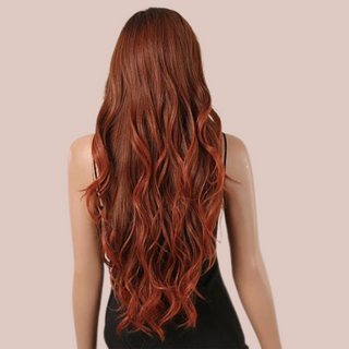 A beautiful soft red wig with blonde highlights running through it. that is shown styled in a long flowing look with a fringe. View from the back showing the long flowing locks.