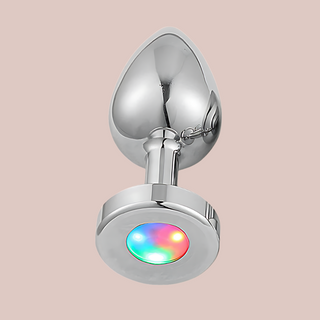 An alternate angle of the Light-Up touch anal plug from House Of Chastity. You can see the anal plug for inserting and the light-up end.