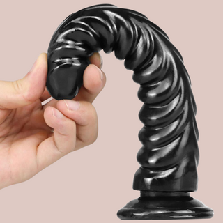 An image of the black ribbed dildo, showing just how flexible the dildo is.