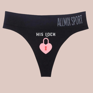 The House Of Chastity Mischievous panties, shown here in black with His Lock and an image of a pink lock printed on the front.