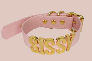 The sissy collar shown here in pink with gold lettering