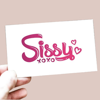 A close up of the Sissy XOXO temporary tattoo, the image has been flipped to show how it reads on skin.