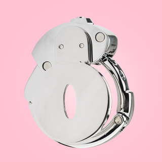 A side view of The Bridewell Chastity Cage, you can see the adjustable base ring has been locked in place and you can see the push lock button at the top.