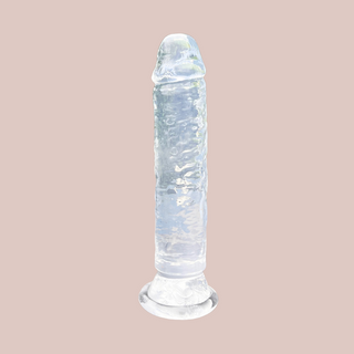 The Clear Translucent Jelly Dildo shown sat on its suction cup base.