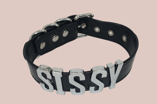 The black sissy collar with silver lettering